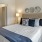 Bedroom with natural lighting and high ceilings